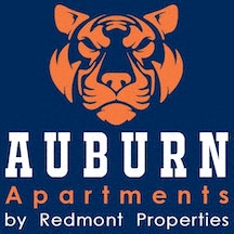 auburn apartments by redemption properties logo with a tigers head on a blue background